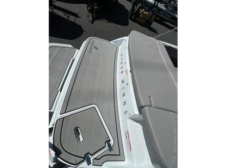 Slide: The Image of 2023 Four Winns H1 boat deck with sleek design and modern features. - 7