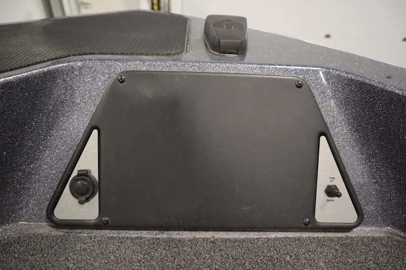 Slide: The Image of 2023 Lund 189 PRO V boat dashboard with control panel and trim switch. - 12