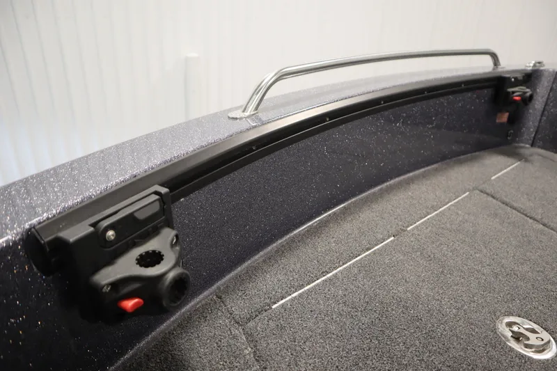 Slide: The Image of 2023 Lund 189 PRO V boat interior with rod holder and carpeted deck. - 14