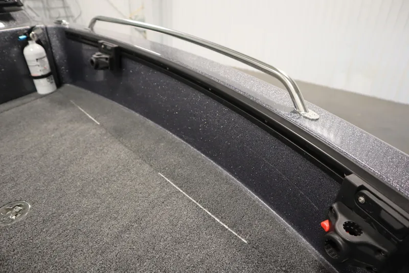 Slide: The Image of 2023 Lund 189 PRO V boat interior with carpeted floor and safety rail. - 15