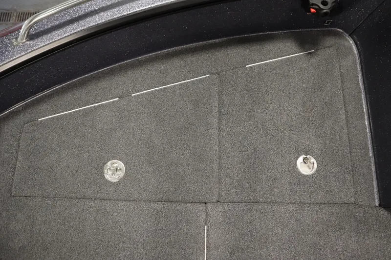 Slide: The Image of 2023 Lund 189 PRO V boat deck with storage compartments and carpeted surface. - 18