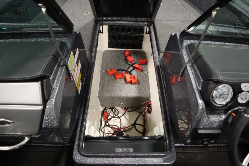 Slide: The Image of 2023 Lund 189 PRO V boat interior showing storage compartment and wiring. - 22
