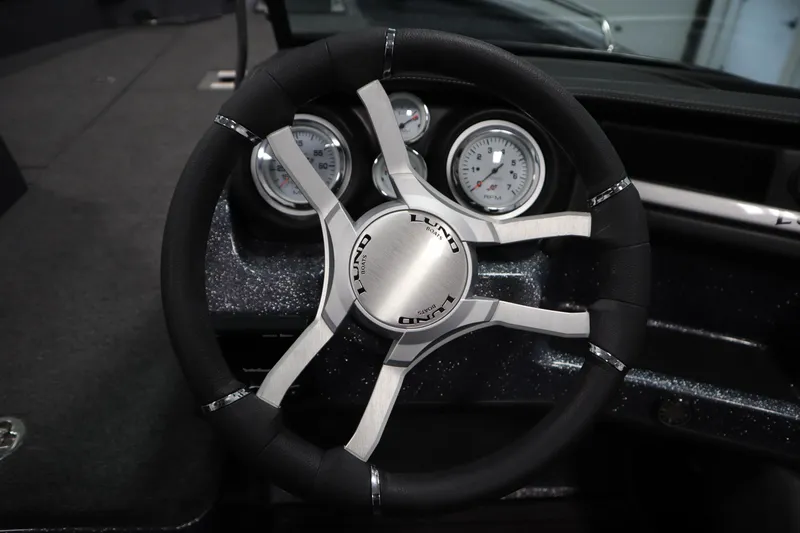 Slide: The Image of 2023 Lund 189 PRO V steering wheel with sleek design and modern gauges. - 27