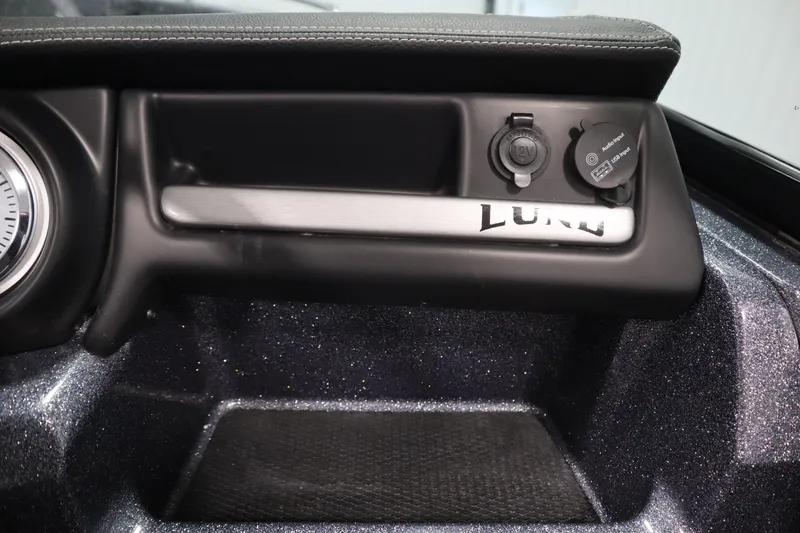 Slide: The Image of 2023 Lund 189 PRO V dashboard with USB and 12V ports. - 29