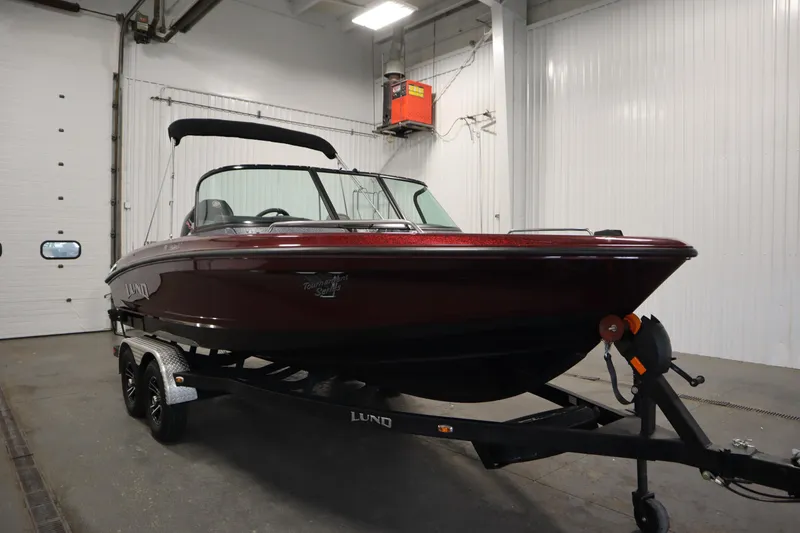 Slide: The Image of 2023 Lund 189 PRO V boat on trailer in indoor storage facility. - 3