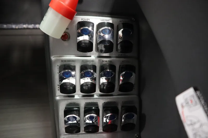 Slide: The Image of Control panel of 2023 Lund 189 PRO V boat with various switches and labels. - 31