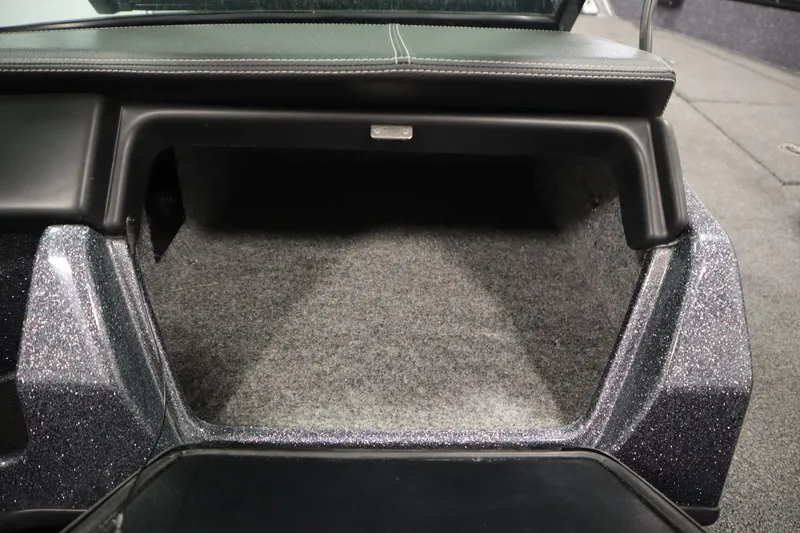 Slide: The Image of 2023 Lund 189 PRO V boat storage compartment with carpeted interior and sleek design. - 36