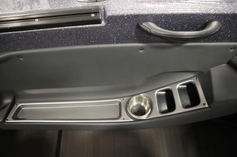 Slide: The Image of 2023 Lund 189 PRO V boat interior with cup holder and storage compartments. - 37
