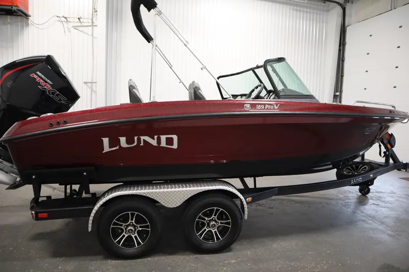 Slide: The Image of 2023 Lund 189 PRO V boat on trailer in indoor setting. - 4
