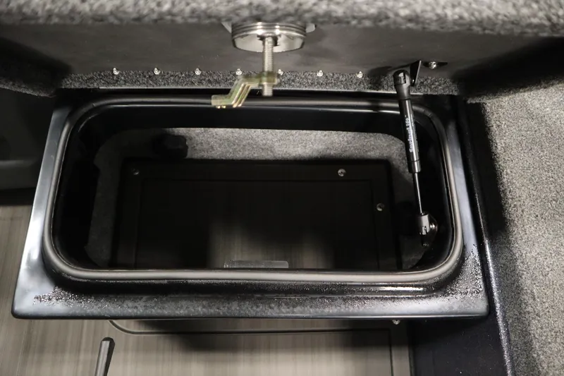 Slide: The Image of Storage compartment in 2023 Lund 189 PRO V boat, featuring secure latch and hydraulic support. - 43