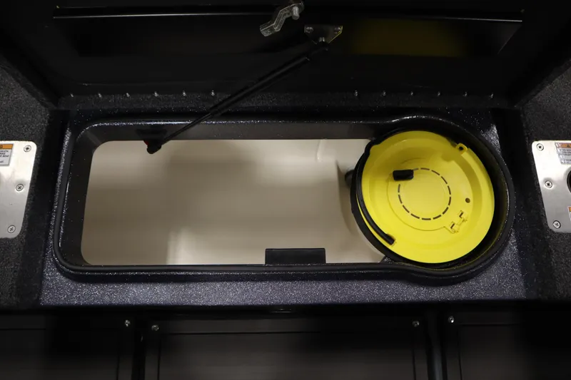 Slide: The Image of 2023 Lund 189 PRO V boat storage compartment with yellow lid. - 47