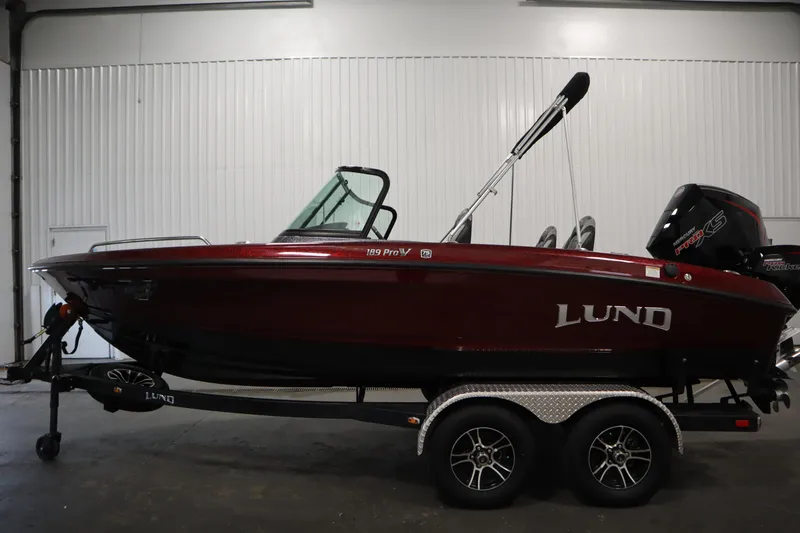 Slide: The Image of 2023 Lund 189 PRO V boat on trailer in indoor setting. - 8
