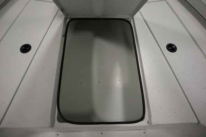 Slide: The Image of Open storage compartment on 2022 Crestliner 2200 CC boat deck. - 17