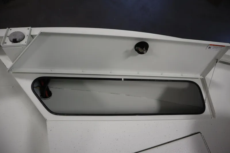 Slide: The Image of Open storage compartment on 2022 Crestliner 2200 CC boat. - 18
