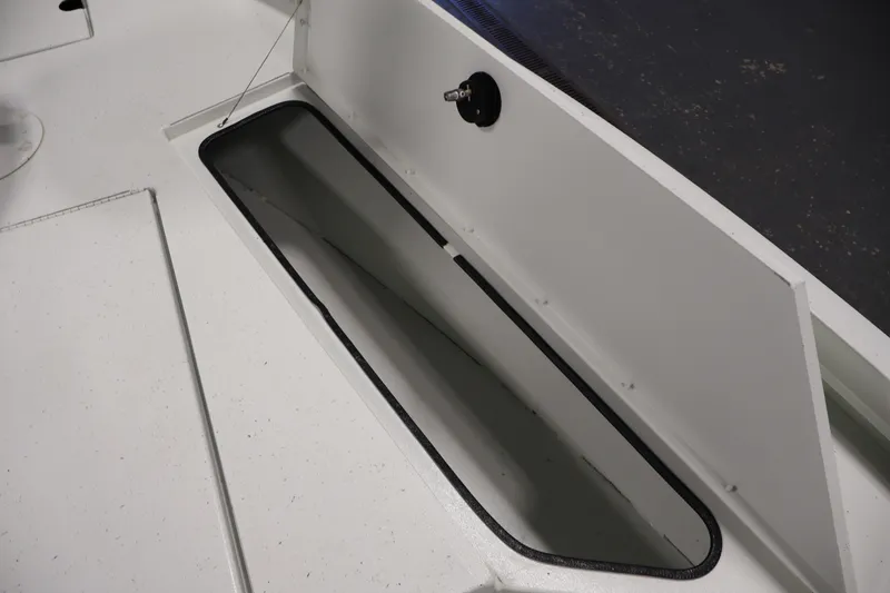 Slide: The Image of Open storage compartment on 2022 Crestliner 2200 Bay boat, showcasing interior space. - 18