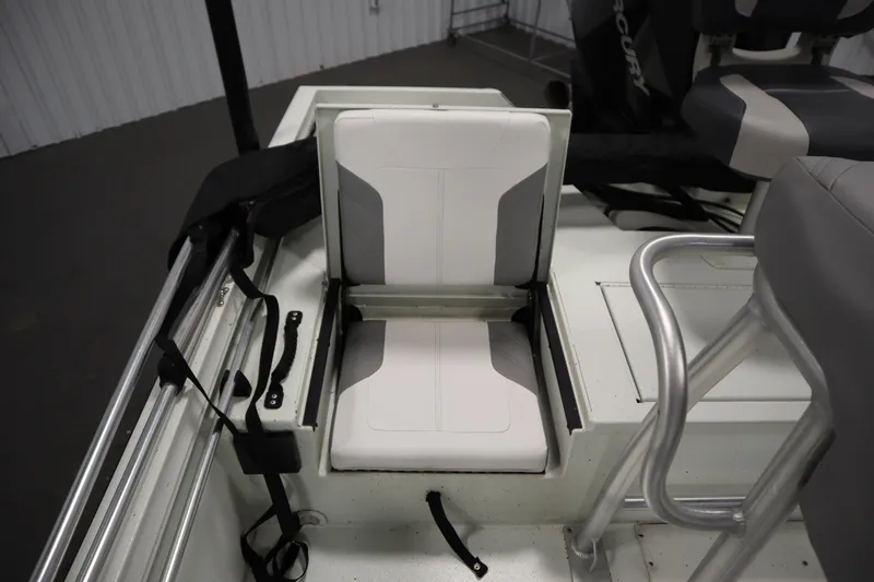 Slide: The Image of 2022 Crestliner 2200 CC boat interior with foldable seat and storage compartment. - 36