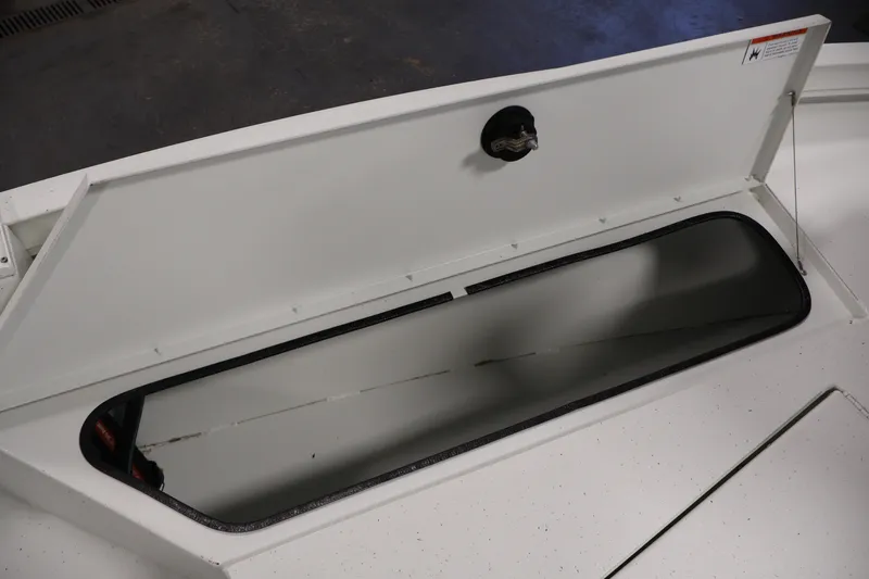 Slide: The Image of Open storage compartment on a 2022 Crestliner 2200 Bay boat. - 16