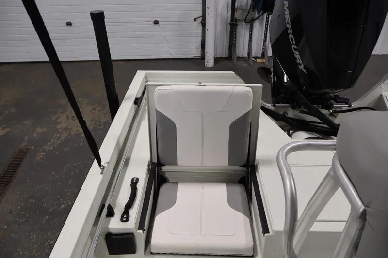 Slide: The Image of 2022 Crestliner 2200 Bay boat interior with Mercury engine and seating. - 34