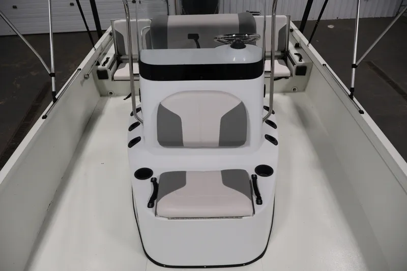 Slide: The Image of 2022 Crestliner 2200 Bay boat interior with steering console and seating. - 19