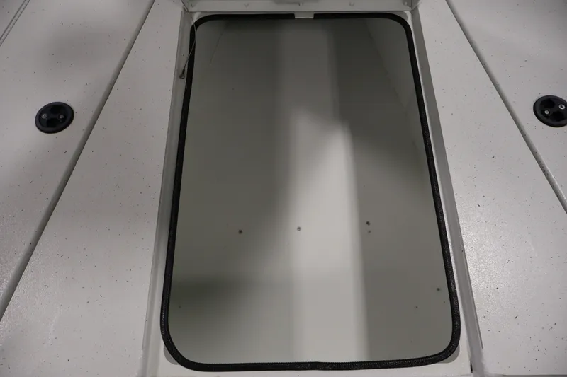 Slide: The Image of Open storage compartment on 2022 Crestliner 2200 Bay boat deck. - 17