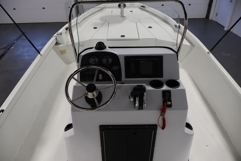 Slide: The Image of 2022 Crestliner 2200 Bay boat interior with steering console and controls. - 23