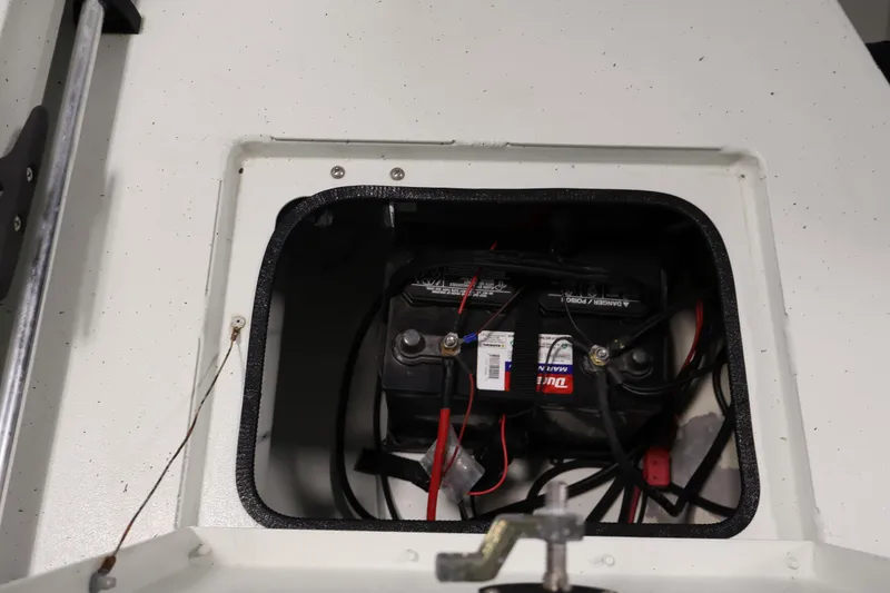 Slide: The Image of Battery compartment of 2022 Crestliner 2200 Bay boat, showing wiring and connections. - 39