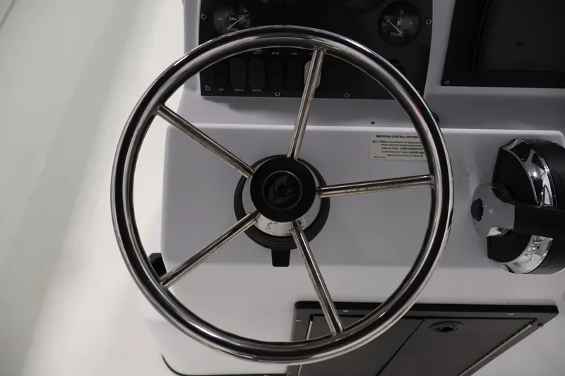 Slide: The Image of Steering wheel and controls of 2022 Crestliner 2200 Bay boat. - 24