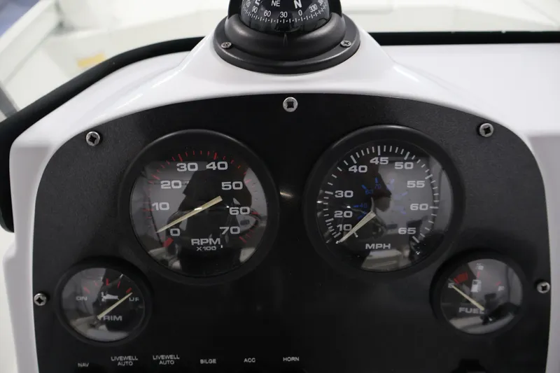 Slide: The Image of Dashboard of 2022 Crestliner 2200 Bay boat with RPM, MPH, and fuel gauges. - 26