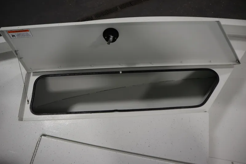 Slide: The Image of Open storage compartment on 2022 Crestliner 2200 CC boat. - 16