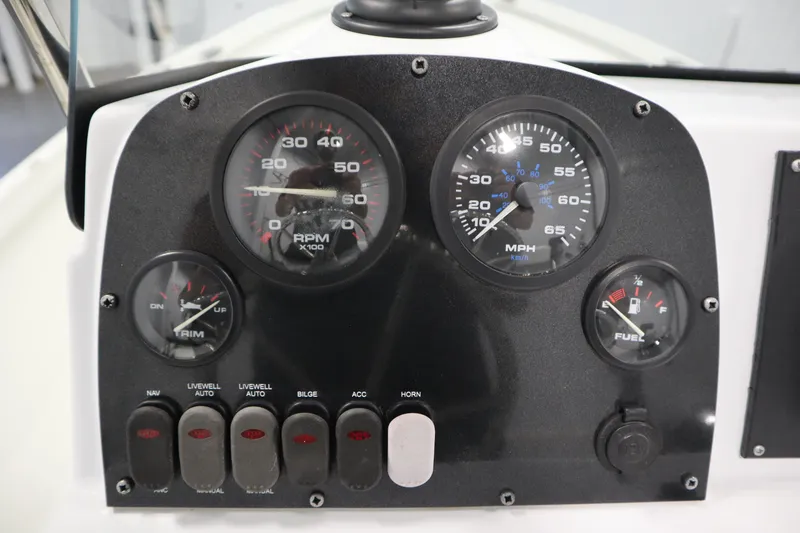 Slide: The Image of Dashboard of 2022 Crestliner 2200 CC boat with gauges and switches. - 26