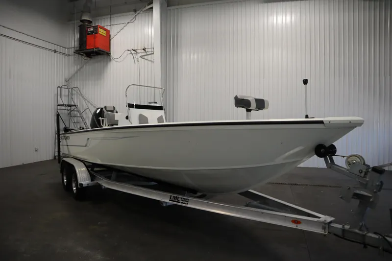 Slide: The Image of 2022 Crestliner 2200 CC boat on trailer in indoor storage facility. - 3