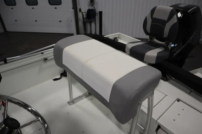Slide: The Image of 2022 Crestliner 2200 CC boat interior with gray and white seating. - 32