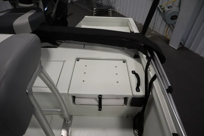 Slide: The Image of 2022 Crestliner 2200 CC boat interior with seating and storage compartments. - 33