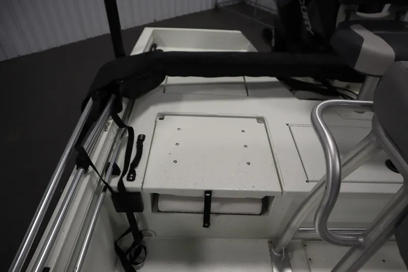 Slide: The Image of 2022 Crestliner 2200 CC boat interior with storage compartment and seating area. - 35