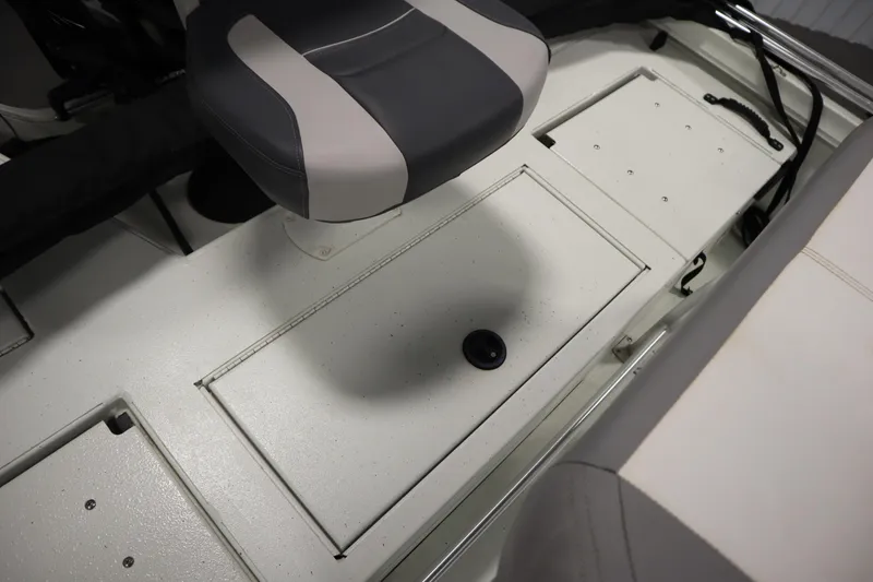 Slide: The Image of Interior of 2022 Crestliner 2200 CC boat showing seating and storage compartments. - 37