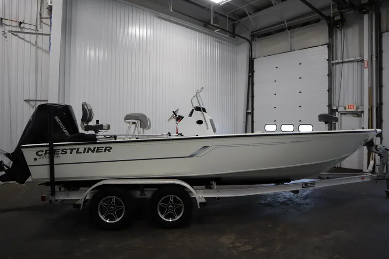 Slide: The Image of 2022 Crestliner 2200 CC boat on trailer in indoor storage facility. - 4