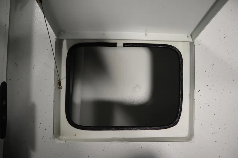 Slide: The Image of Open storage compartment on 2022 Crestliner 2200 CC boat. - 43