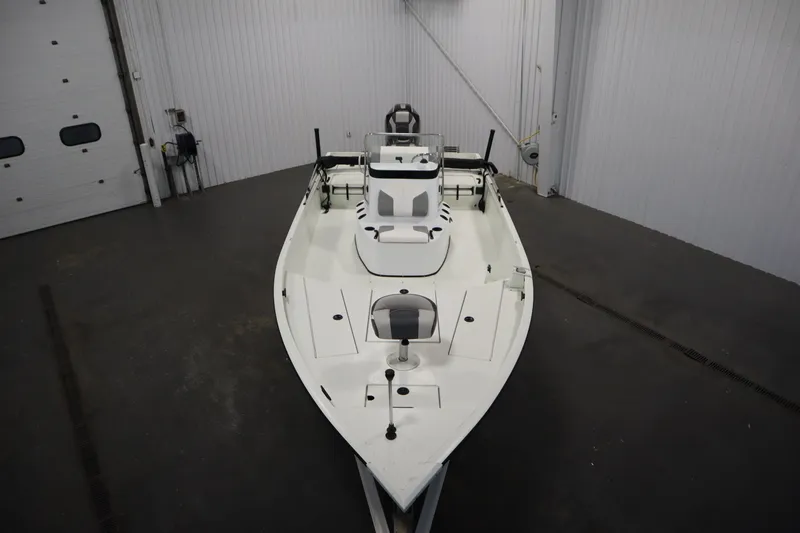 Slide: The Image of 2022 Crestliner 2200 CC boat in indoor storage, top view. - 9