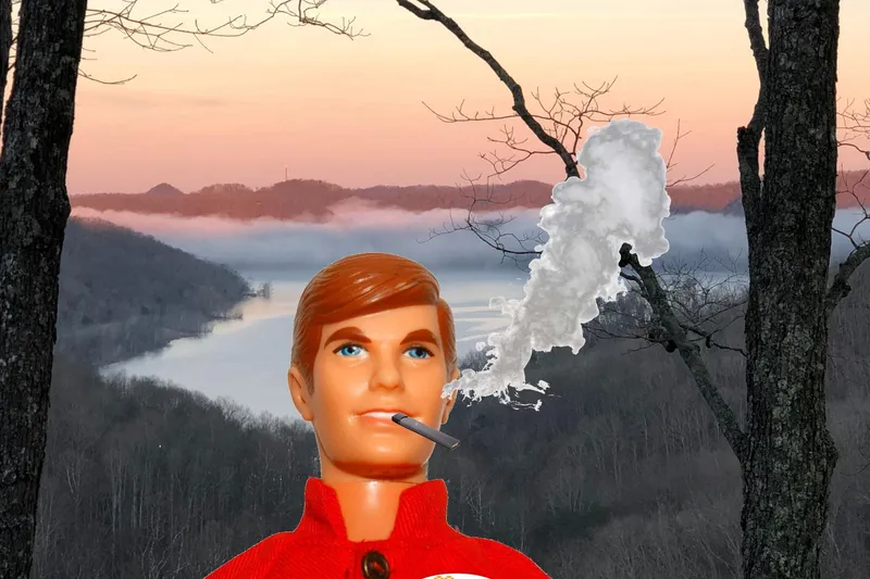 Slide: The Image of Toy figure smoking in front of misty lake and forest at sunrise, 33rd Strike Group FOX-3637. - 45