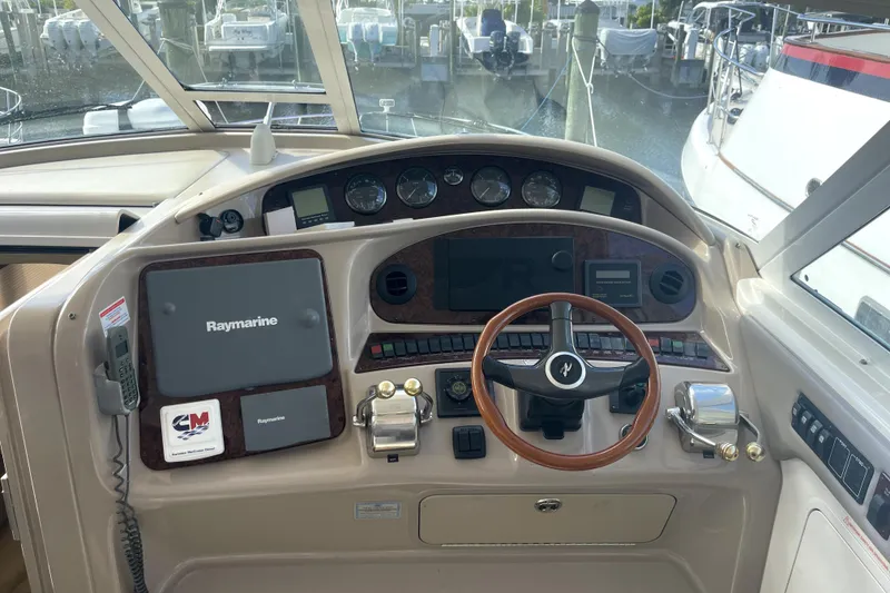 Slide: The Image of Boat cockpit with Raymarine navigation, steering wheel, and control panel, 33rd Strike Group FOX-3637, 2026 model. - 67
