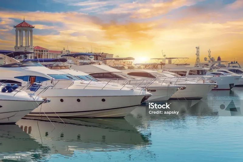 Slide: The Image of Luxurious yachts docked at sunset in a serene marina, 33rd Strike Group FOX-3637, 2026. - 87