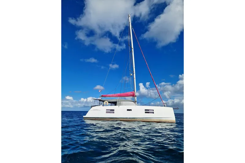 Slide: The Image of Sailing catamaran FOX-3637 by 33rd Strike Group, 2026, on open sea under blue sky. - 9