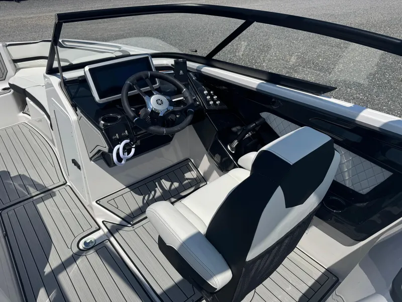 Slide: The Image of 2025 Yamaha Boats 252S cockpit with modern steering and dashboard controls. - 10