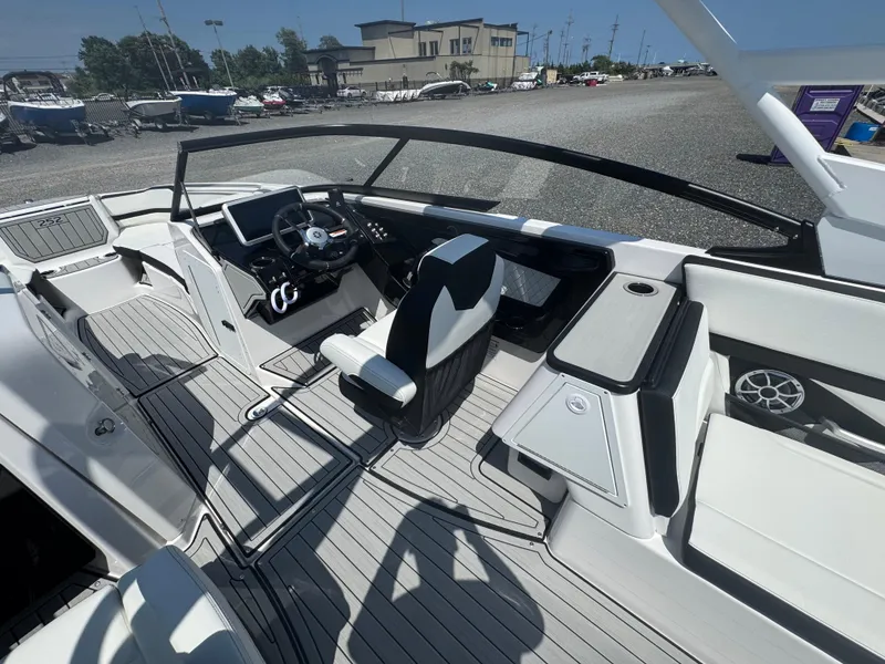Slide: The Image of 2025 Yamaha Boats 252S interior with sleek design and modern dashboard controls. - 14