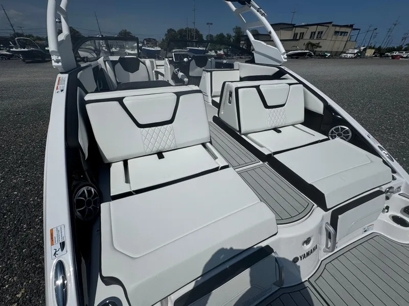 Slide: The Image of 2025 Yamaha Boats 252S interior with sleek white seating and modern design. - 4