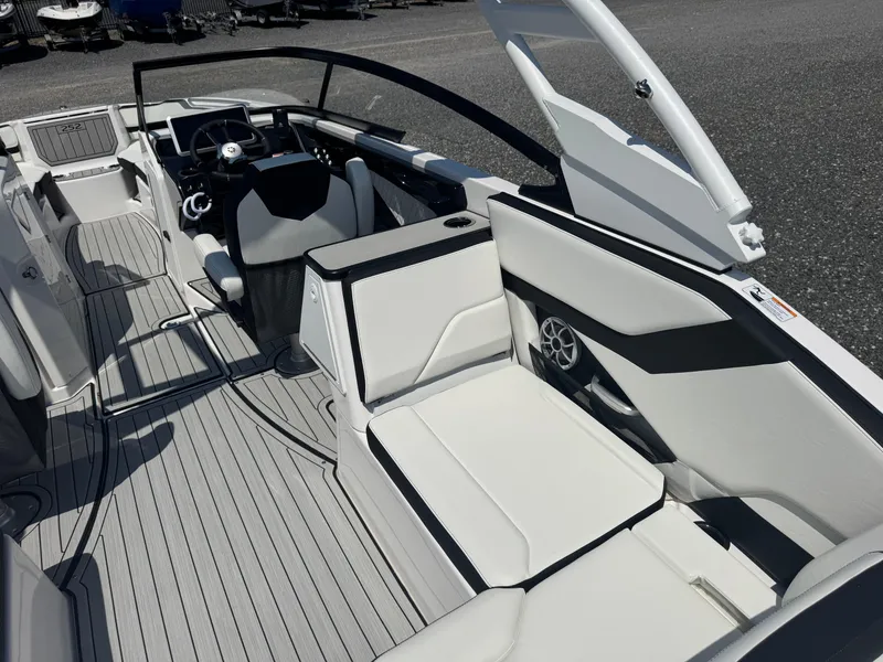 Slide: The Image of 2025 Yamaha Boats 252S interior with sleek seating and modern dashboard design. - 9