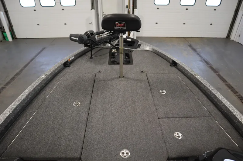 Slide: The Image of 2023 Ranger Z519 boat interior with fishing seat and storage compartments. - 11