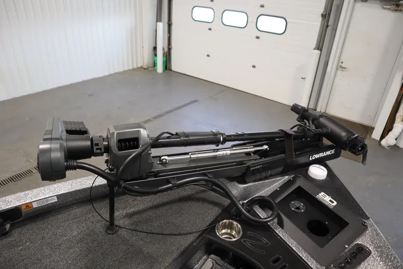 Slide: The Image of 2023 Ranger Z519 boat with Lowrance Ghost trolling motor in a garage setting. - 12