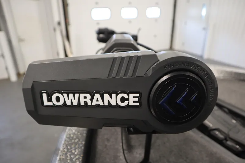 Slide: The Image of Lowrance device on 2023 Ranger Z519 boat, close-up view in a garage setting. - 15