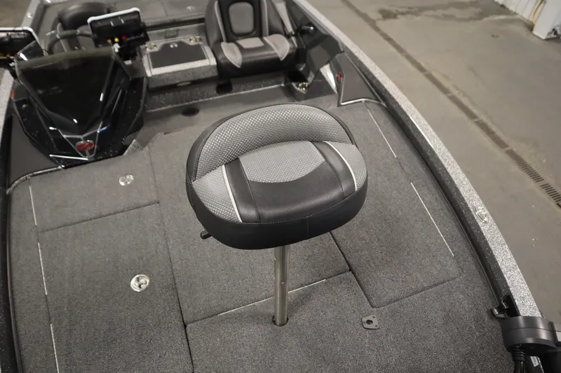 Slide: The Image of 2023 Ranger Z519 boat interior with swivel seat and carpeted deck. - 17
